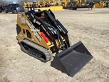 Back of new Mini Skid Steer,Side of new Boxer,New Boxer Mini Skid Steer in yard